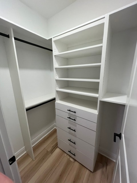 Custom pantry with built-in shelving and beverage fridge