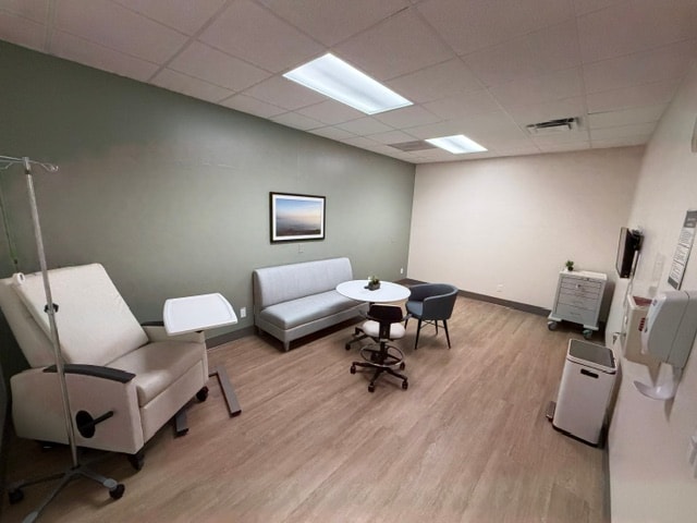 Completed commercial medical office patient room with LVP flooring