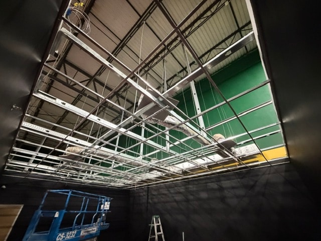 Commercial drop ceiling grid installation with scissor lift