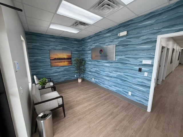 Commercial space renovation with textured blue wallpaper and flooring